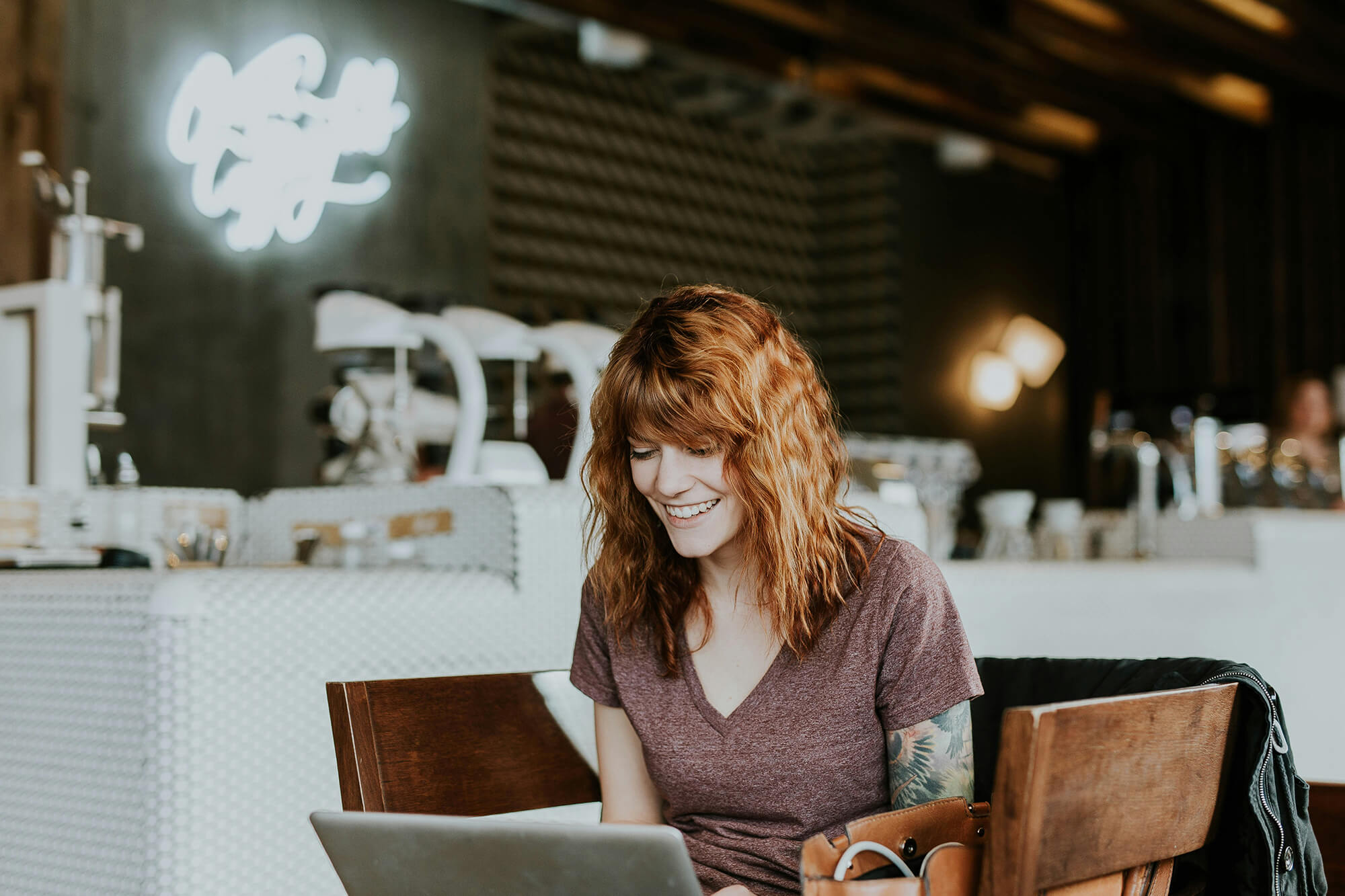 online experiences_laptop at cafe_by brooke cagle - unsplash